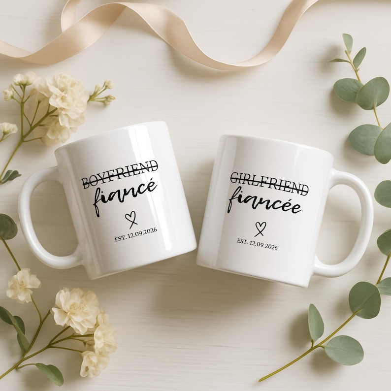 "Boyfriend fiancé" and "Girlfriend fiancée" mugs with heart and "EST. 12.09.2026" text.