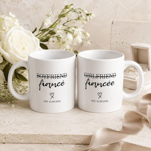 Boyfriend Fiancé and Girlfriend Fiancée mugs with date and heart detail.