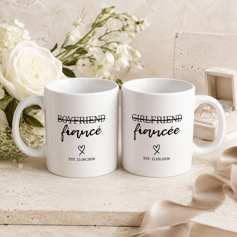 Boyfriend Fiancé and Girlfriend Fiancée mugs with date and heart detail.