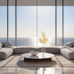 May include: A modern living room with a panoramic ocean view. Features a large, light gray sectional sofa with several throw pillows. A round marble coffee table and decorative vase with dried plants complete the scene.