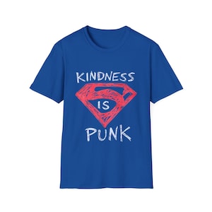 May include: Royal blue t-shirt with the words "KINDNESS IS PUNK" in white lettering. The word "IS" is inside a red diamond-shaped graphic, resembling a superhero logo.