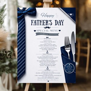 May include: A Father's Day menu sign featuring a navy blue striped necktie graphic, a dark blue bowtie, and a silver fork and knife set tucked into a navy napkin. The white card displays text including Happy Father's Day, Special Menu, and food items.
