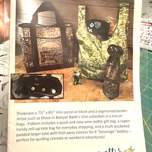 May include: Image of a "Tote Bag Trio" pattern by Patti's Patchwork. The pattern showcases three bag designs: a tote bag, a wine bottle gift bag, and a roll-up tote bag. The tote bag has a brown and tan design with a landscape graphic.
