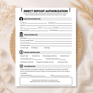 May include: A white Direct Deposit Authorization form with black text and lines for employee information, bank details, and deposit instructions. The document includes sections for name, address, account numbers, and a signature line for authorisation.