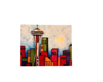 Stampa artistica incorniciata 8x10 di Kate Larsson raffigurante lo Space Needle di Seattle, con skyline colorato.