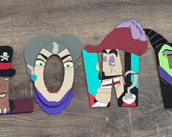 May include: Wooden letters spelling "HALLOWEEN" are decorated with Disney villain characters. The letters are painted in various colours, including orange, black, red, and purple. The characters include Scar, Jafar, and Ursula.