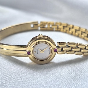 Vintage Seiko Gold-Tone Bracelet Watch – Asymmetrical Design, Ruby Accents