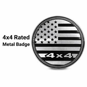 May include: A round, silver metal badge with a design resembling the American flag. The badge features stars and stripes, with the text "4x4" at the bottom. The words "4x4 Rated Metal Badge" are printed on the left.