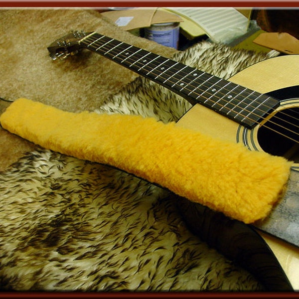 SHEEPSKIN PAD for your Guitar Strap. We will glue a sheepskin pad to your strap or ship it to you so you may attach it yourself.