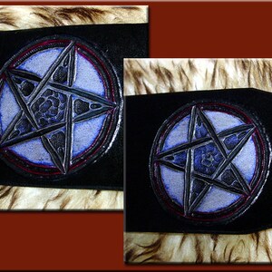 May include: Two black leather patches with a silver pentagram design. The pentagram is outlined in red and blue.