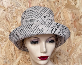 Newsprint fabric bucket hat with tall tapered crown, handmade from recycled furnishing fabric, genderless hat