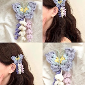 Könnte beinhalten: Gehäkelte Haarspange in Schmetterlingsform in Lila, Blau und Gelb. Der Schmetterling hat ein mehrschichtiges Design mit einem kaskadierenden floralen Akzent in Weiß, Lavendel und Lila. Ein einzigartiges Haaraccessoire.