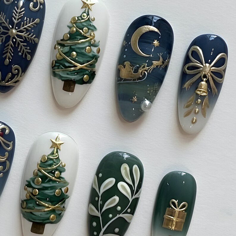 May include: A collection of Christmas-themed nail art designs. The nails feature festive elements like Christmas trees, snowflakes, a crescent moon with Santa's sleigh, and gift boxes, all in gold and green hues. The designs are set against a white background.