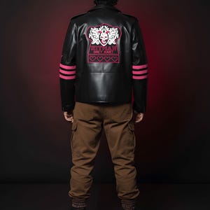 May include: Black leather jacket with pink accents and the text "HITMAN BRET HART" on the back. The jacket has pink stripes on the sleeves and is paired with brown cargo pants and boots. The overall style is edgy and bold.
