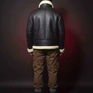 May include: A black leather jacket with a cream-colored shearling collar and trim. The jacket is worn with brown cargo pants and brown boots. The person is facing away from the camera against a dark background.