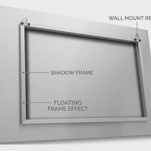 May include: A rectangular silver metal panel featuring a shadow frame on the reverse side. The back includes two wall mount ready brackets. Text labels indicate SHADOW FRAME, FLOATING FRAME EFFECT, and WALL MOUNT READY. A small logo tag reads PICOR.