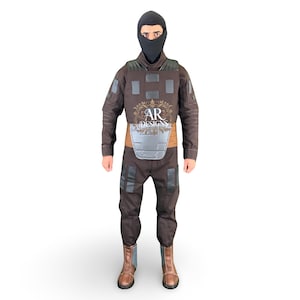 May include: A brown tactical suit with a black balaclava, featuring a chest plate and knee pads. The suit includes a brown belt and brown boots. The text "AR DESIGNS" is visible on the chest.