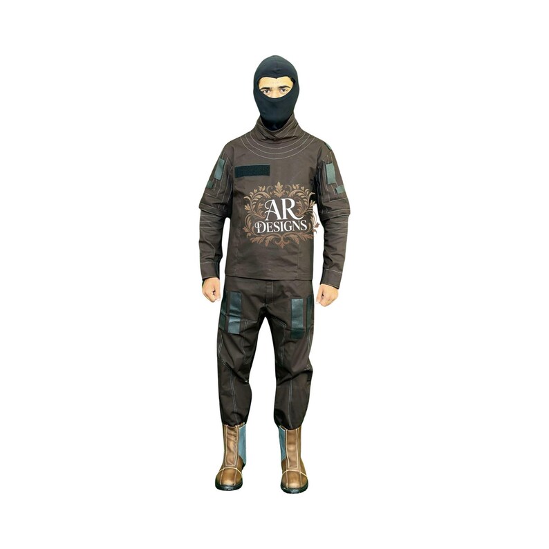 May include: A brown tactical uniform featuring a balaclava, long-sleeved shirt, and trousers. The shirt has a patch and the text "AR DESIGNS". The trousers have knee pads, and the boots are brown.