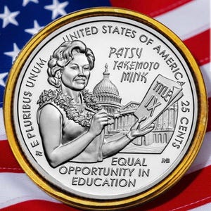 May include: A silver and gold coin featuring Patsy Takemoto Mink, the U.S. Capitol, and the text "Title IX" and "Equal Opportunity in Education." The coin is set against a backdrop of the American flag, with the words "United States of America" and "25 Cents" visible.