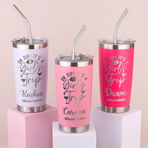 May include: Three stainless steel travel tumblers with lids and straws. The tumblers are in shades of pink and lavender, each with the text "OH SIP! IT'S A Girl's Trip" and a name and "Miami 2026".