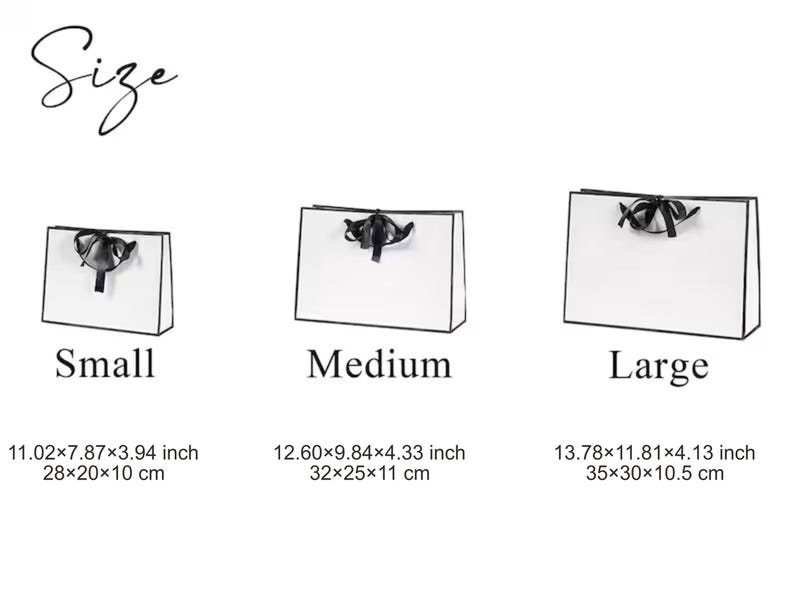 May include: Three white gift bags with black trim and black ribbon handles, labelled Small, Medium, and Large. Dimensions are 28x20x10 cm, 32x25x11 cm, and 35x30x10.5 cm respectively, with the word Size displayed at the top of the image.