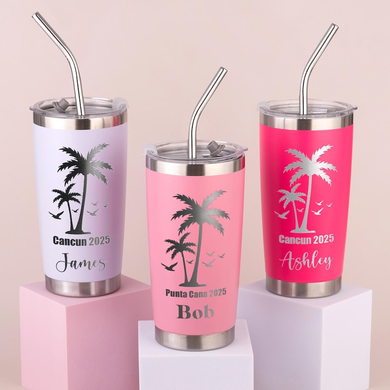 May include: Three stainless steel tumblers in pink, lavender, and hot pink, each with a silver lid and straw. The tumblers feature a palm tree design and the text "Cancun 2025" or "Punta Cana 2025" with a name below.
