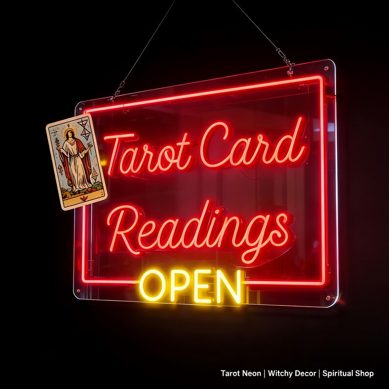 May include: A rectangular neon sign with a black background featuring the red glowing text Tarot Card Readings and the yellow glowing text OPEN. A tarot card illustration is attached to the upper left corner of the clear acrylic frame.