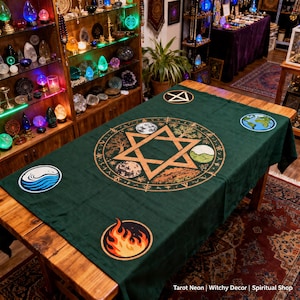 May include: A dark green tarot cloth with a central design featuring a Star of David, surrounded by symbols of the elements. The cloth has circular patches with elemental symbols. The text "Tarot Neon | Witchy Decor | Spiritual Shop" is at the bottom.