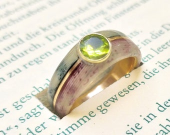 Custom engagement ring made of personal paper and gold, and gemstone