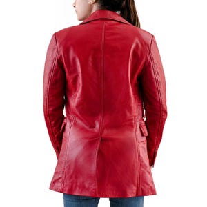 May include: A vibrant red leather jacket with a classic tailored design. The jacket features a notched collar, two front pockets, and a single-breasted closure. The back view showcases the jacket's sleek silhouette and quality craftsmanship. A stylish outerwear piece.