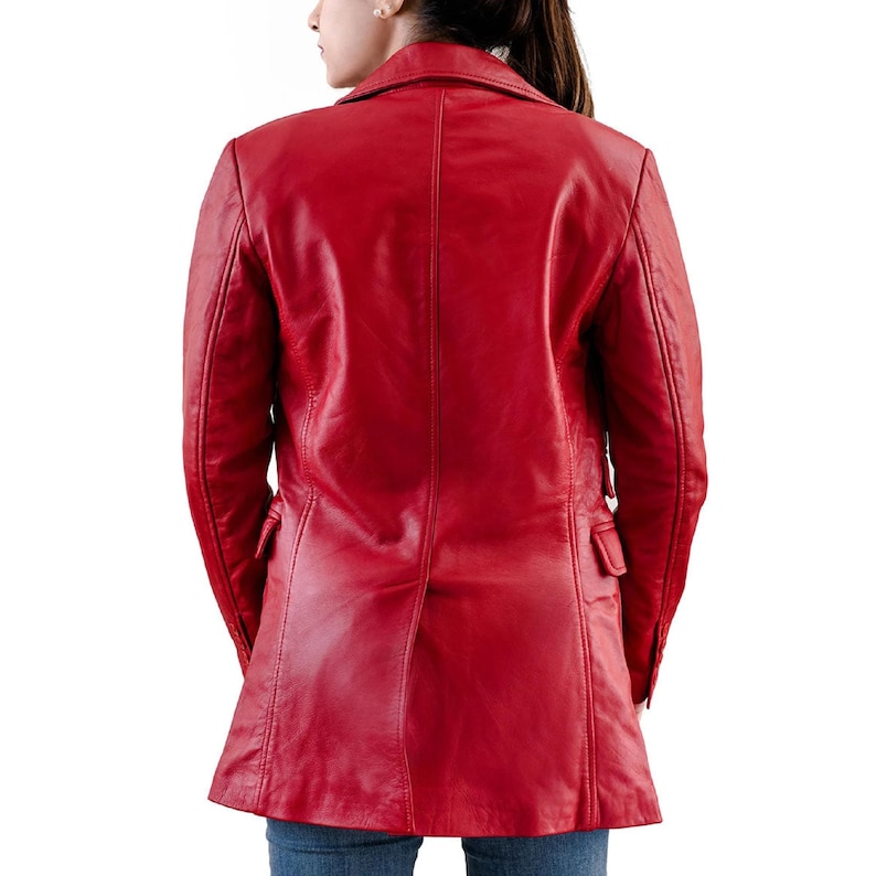 May include: A vibrant red leather jacket with a classic tailored design. The jacket features a notched collar, two front pockets, and a single-breasted closure. The back view showcases the jacket's sleek silhouette and quality craftsmanship. A stylish outerwear piece.