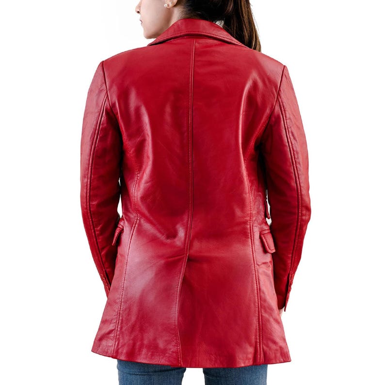 May include: A vibrant red leather jacket with a classic lapel collar and two front pockets. The jacket is tailored with a fitted silhouette and a mid-thigh length. The back view showcases the jacket's clean lines and quality craftsmanship.