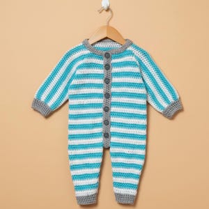 May include: A handmade crochet baby romper with horizontal turquoise and white stripes. The romper has long sleeves, a round neckline, and is fastened with grey buttons down the front. The cuffs and neckline are trimmed in grey.