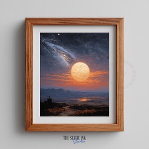 Puede incluir: Una impresión enmarcada de una pintura de paisaje con una luna grande y brillante en un cielo al atardecer. La obra de arte tiene una paleta de colores cálidos con tonos naranja, amarillo y azul. El marco es de madera. El texto "THE STATIC INK Studio" está en la parte inferior.