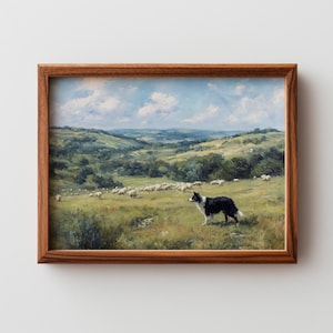 May include: A framed landscape painting shows a rural scene with green hills, a flock of sheep, and a black and white Border Collie dog. The artwork is set in a wooden frame.