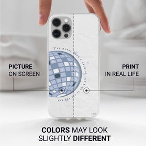 May include: Clear phone case featuring a light blue disco ball design with the text "I've never been a natural, all I do is try..." and "-T.S." The case has a white background and is held by a hand.
