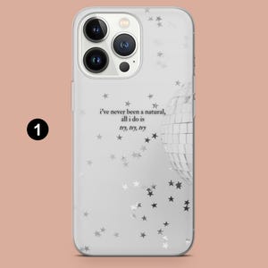 May include: Clear phone case with a white background, featuring a disco ball and star pattern. The case has the text "i've never been a natural, all i do is try, try, try". The phone case has a camera cutout.