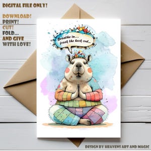 May include: A digital art print featuring a cartoon capybara in a yoga pose, with a speech bubble saying "Breathe in... freak the heck out...". The capybara is wearing colorful clothing and has a crown of colorful objects. The print also includes the text "DIGITAL FILE ONLY! DOWNLOAD! PRINT! CUT! FOLD... AND GIVE WITH LOVE!"
