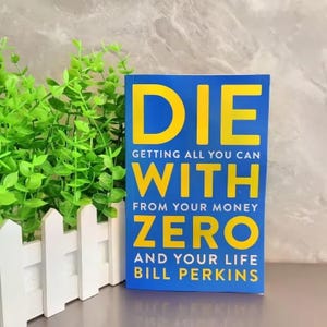 May include: A hardcover book titled "DIE WITH ZERO" by Bill Perkins. The book has a blue cover with large yellow text. The title is stacked, with the words "DIE", "WITH", and "ZERO" prominently displayed.