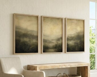 May include: A set of three rectangular wall art prints featuring a misty, atmospheric landscape in muted tones of beige, olive green, and dark charcoal. Each print displays a hazy forest scene with soft gradients and a subtle, painterly texture.