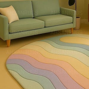 Round pastel area rug with abstract wavy pattern in soft hues of lavender, blush, yellow, green, and blue. Handmade wool rug styled in a modern boho living room with light green sofa, wooden cabinet, and neutral decor.