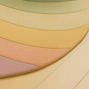 Round pastel area rug with abstract wavy pattern in soft hues of lavender, blush, yellow, green, and blue. Handmade wool rug styled in a modern boho living room with light green sofa, wooden cabinet, and neutral decor.