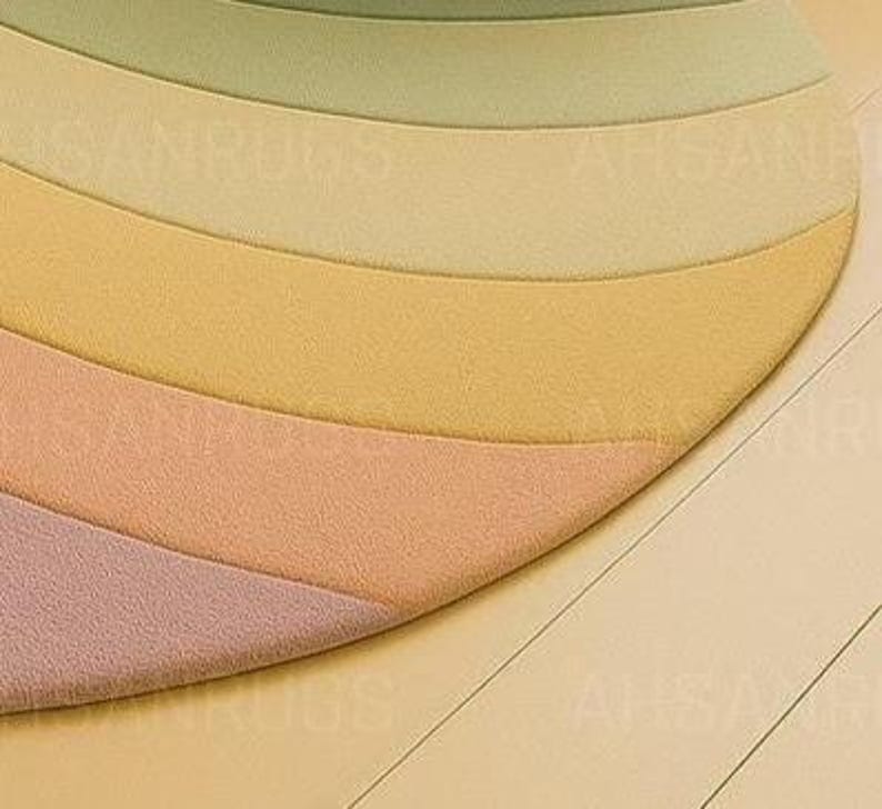 Round pastel area rug with abstract wavy pattern in soft hues of lavender, blush, yellow, green, and blue. Handmade wool rug styled in a modern boho living room with light green sofa, wooden cabinet, and neutral decor.