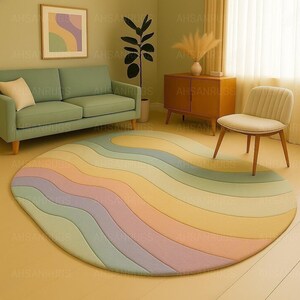 Round pastel area rug with abstract wavy pattern in soft hues of lavender, blush, yellow, green, and blue. Handmade wool rug styled in a modern boho living room with light green sofa, wooden cabinet, and neutral decor.