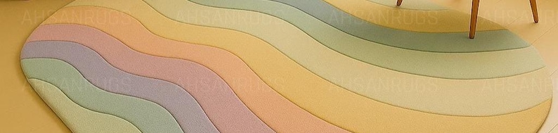 Round pastel area rug with abstract wavy pattern in soft hues of lavender, blush, yellow, green, and blue. Handmade wool rug styled in a modern boho living room with light green sofa, wooden cabinet, and neutral decor.