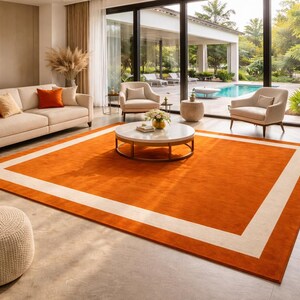 modern-orange-area-rug-cream-border-handmade-living-room-rug.jpg