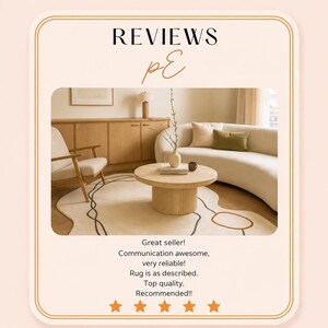 May include: A beige rug with a cream-colored background and a brown and black abstract design. The rug is in a living room setting with a round wooden coffee table and a curved sofa. The text "REVIEWS" is at the top.