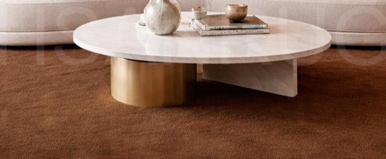 Luxury solid brown area rug with soft wavy edges placed in a modern minimalist living space, contemporary carpet on marble floor with wooden table and neutral walls, elegant modern rug for living room bedroom and hallway décor