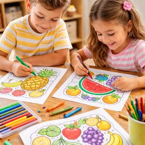 May include: Two children coloring fruit-themed pictures with crayons. The drawings include a pineapple, watermelon, grapes, and other fruits. A box of crayons and a cup of colored pencils are on the wooden table.