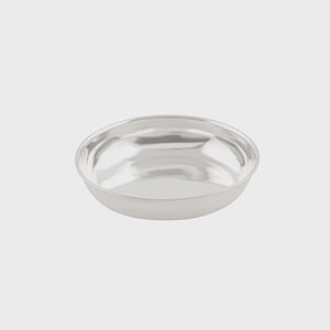 May include: A shallow, circular bowl with a polished, reflective silver-toned finish. The bowl features a smooth, curved interior and a simple, rounded rim, presenting a clean and uniform metallic appearance throughout the entire object.